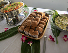 Food spread of grapes, nuts, crackers, and cheese.